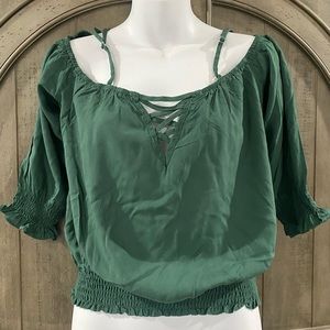 Strapped off the shoulder top in a forest green